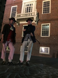 Note the stripes and sticks in the 'shore-going rig' of two recreated American merchant seamen, c. 1770s (Adam Hodges-LeClaire at left, Sean O'Brien at right), outside Old State House (Boston, Massachusetts (2015).
