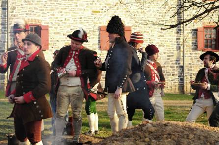A sailor wearing a thrum cap amongst other members of the recreated Charles Wilson Peale's company of 2nd Battalion Philadelphia Associators (Old Barracks Museum, Trenton, New Jersey, 2015) [Photo credit to Todd Lacy].